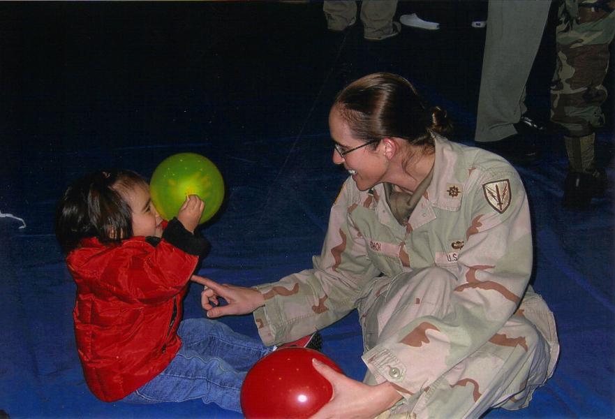 Erica Choi shown playing with a young girl.
