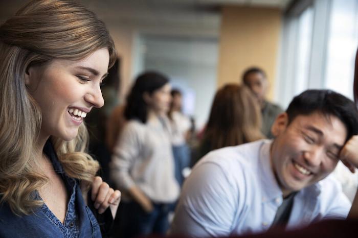 Two Essity employees shown having a conversation.