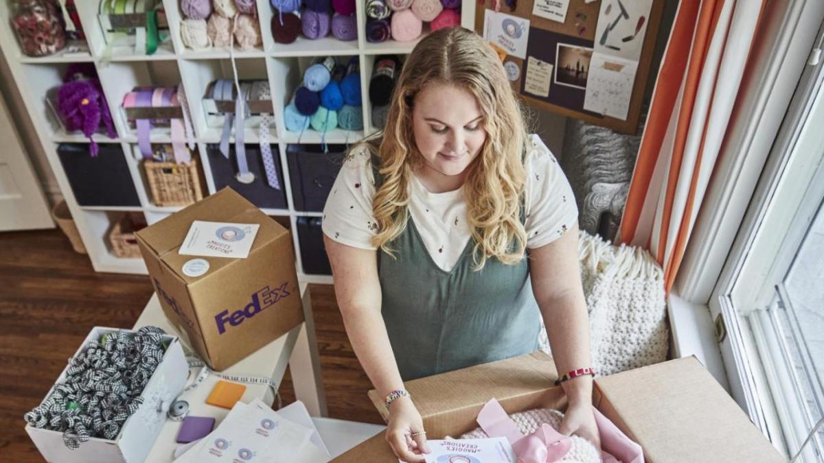 person packing up orders