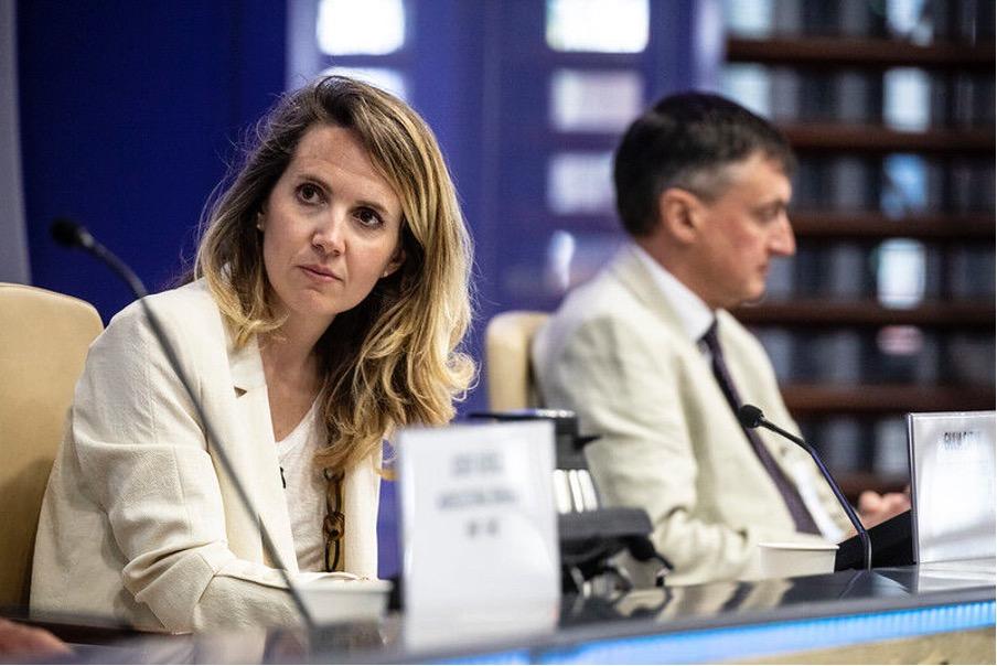 Two people seated next to one another at FAO-CEMA Signing Ceremony