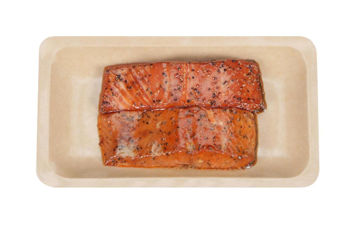 Photo of two smoked salmon fillets sitting in tray packaged for retail sale