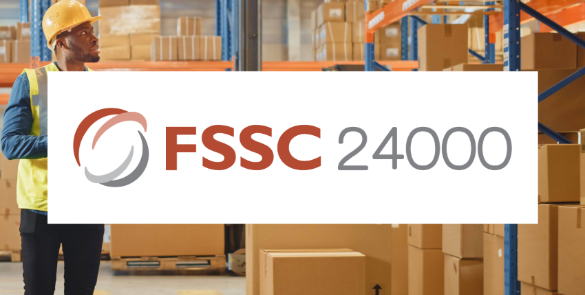 "FSSC 24000" over the image of a person in safety gear looking at shelves of boxes.