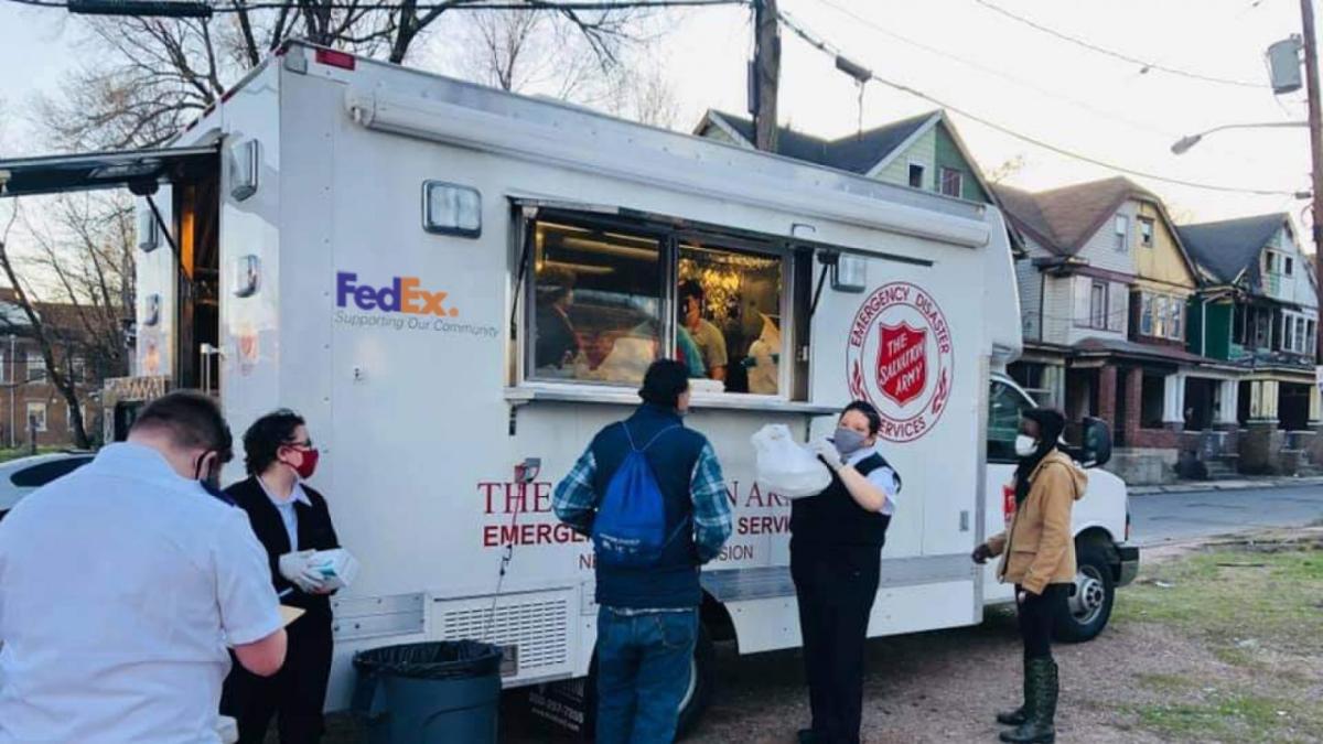 people waiting near food truck