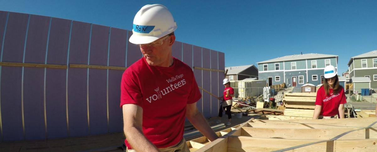 Ron Hostetler and other Wells Fargo team members work together in Sheridan, Colorado, to help build a Habitat for Humanity home completely sponsored by Wells Fargo.