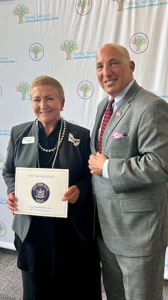 Lydia Biskup (left), Chief of Staff of New York State Senator Rob Rolison’s office, presents KeyBank’s Hudson Valley/Metro NY President John Manginelli with a proclamation from the senator’s office.