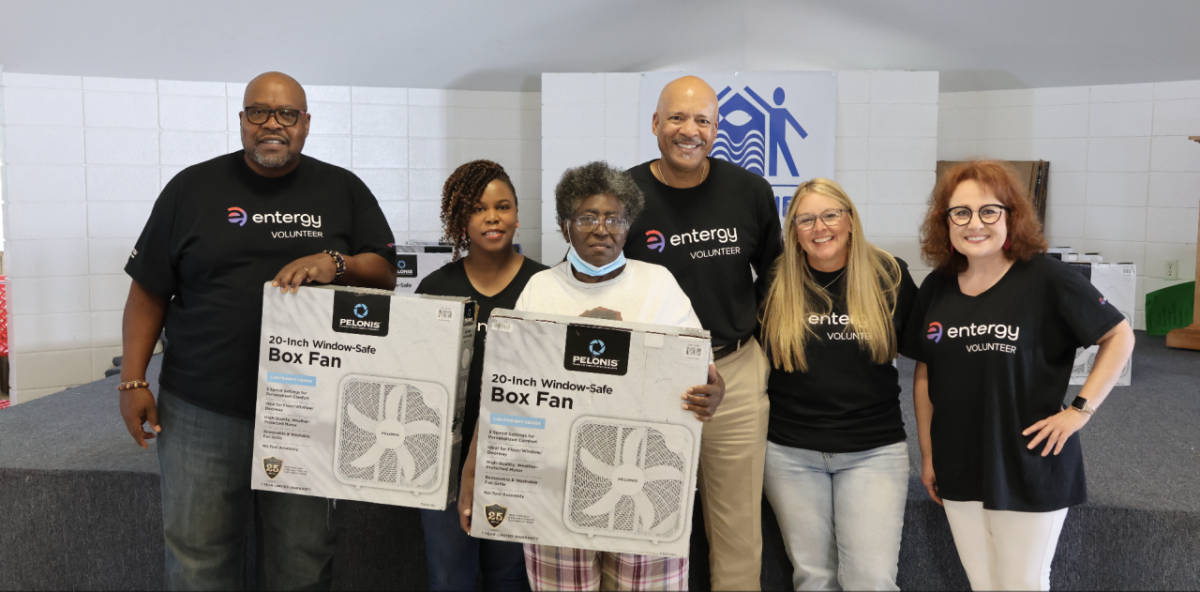 Entergy customer Erie Blakely receives a fan from Entergy Volunteers. " "