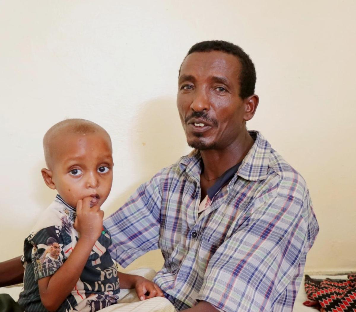 Gebremedihin and his son at the Action Against Hunger-supported clinic