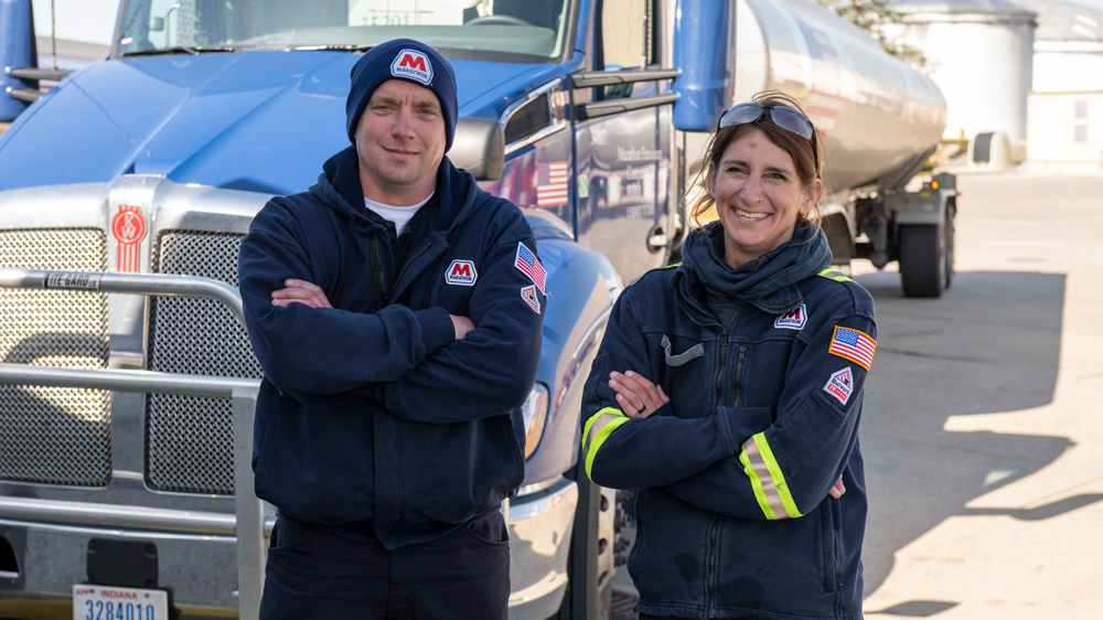 Fenton and Drummond in front of a truck