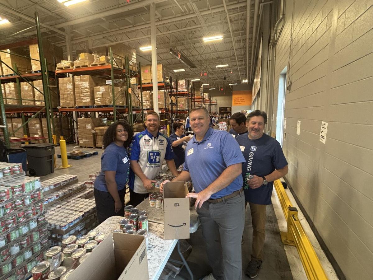 Volunteers pack boxes