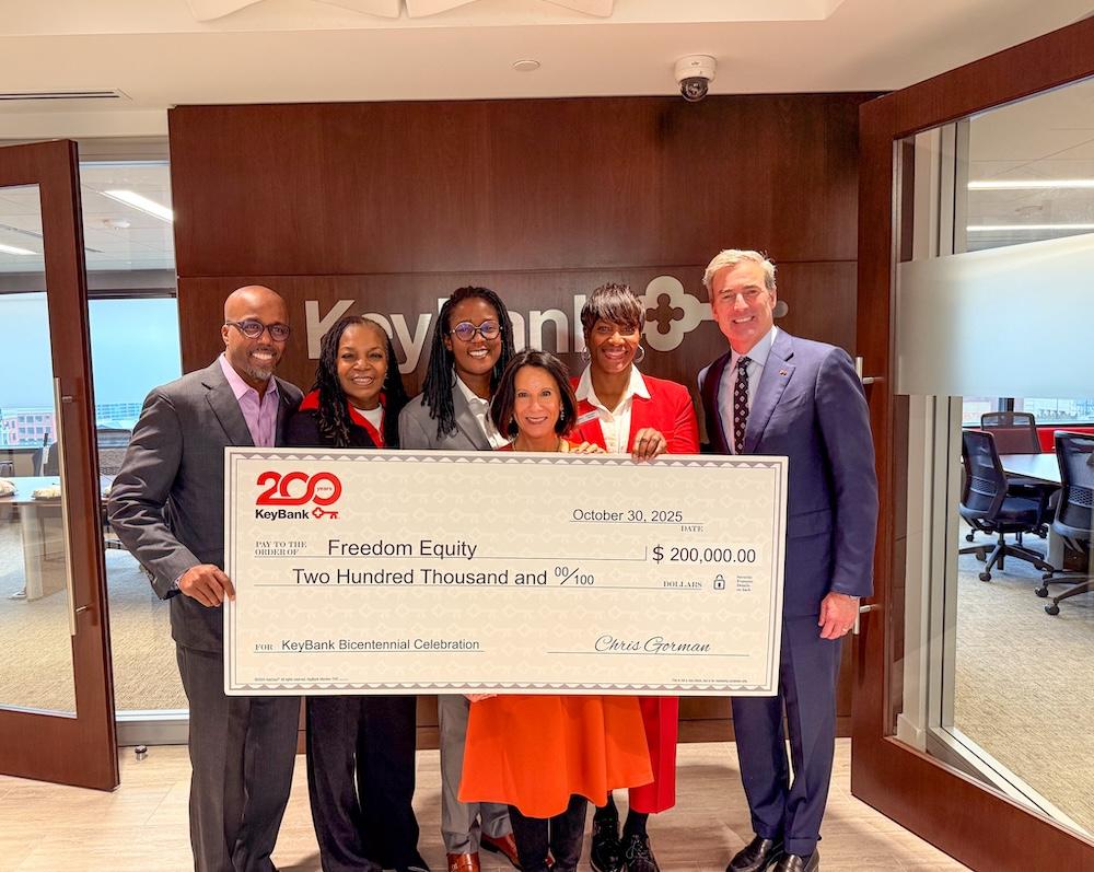 Freedom Equity and KeyBank representatives shown with a $200,000 grant check.