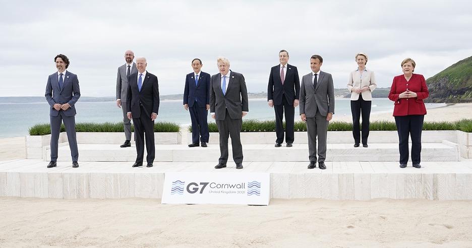 Leaders of the G7 pose for a group photo overlooking the beach at the Carbis Bay Hotel in Carbis Bay, St. Ives, Cornwall, England, Friday, June 11, 2021 | Patrick Semansky/Pool/AP 9 Leaders of the G7 pose for a group photo overlooking the beach