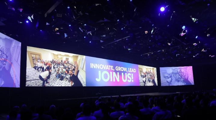 Screen behind the stage for GFC displaying the words, "Join Us!" 