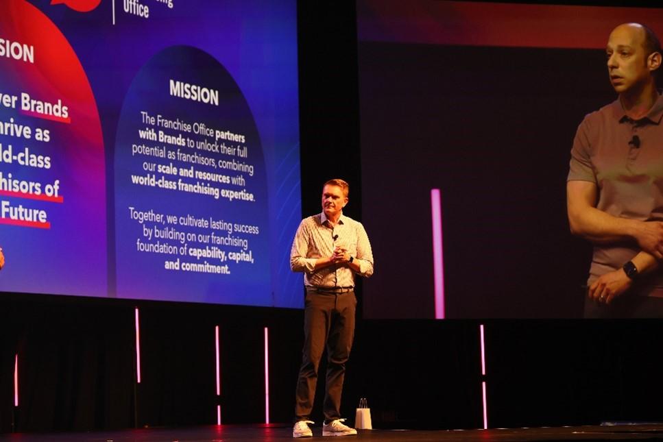 Presenter on stage at GFC