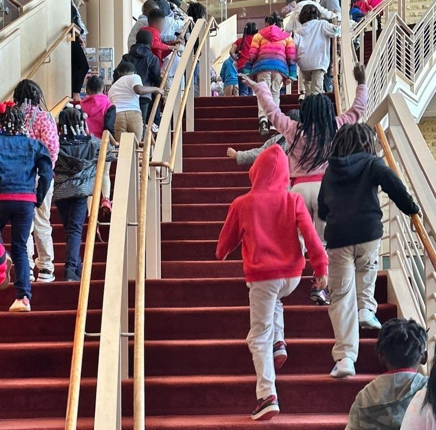 Students from MLK Elementary School shown going to see the musical.