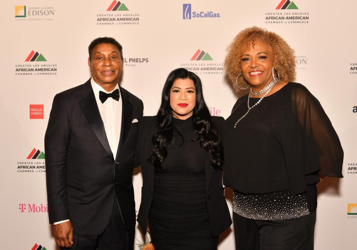 Gene Hale (Chairman, GLAAACC) and Angela Gibson Shaw (President, GLAAACC) congratulated Christina Tulfo (Supplier Diversity Manager, AEG) on AEG's recognition.