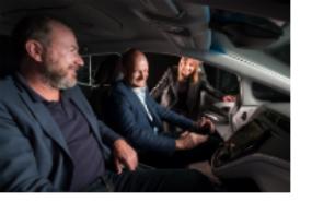 General Motors President Dan Ammann (left) and GM Chairman and CEO Mary Barra (right) give SoftBank Investment Advisers Managing Partner Michael Ronen a closer look at the Cruise AV on Wednesday, May 30, 2018 in Detroit, Michigan. (Photo by Steve Fecht for General Motors)