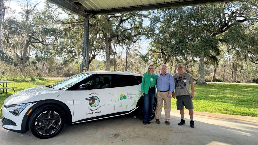 (L to R): Rebecca Emrick, Martin Hagne, and Mike Williams representing Green Mountain Energy Sun Club and Gulf Coast Bird Observatory at the "Flip the Switch" event on January 8.