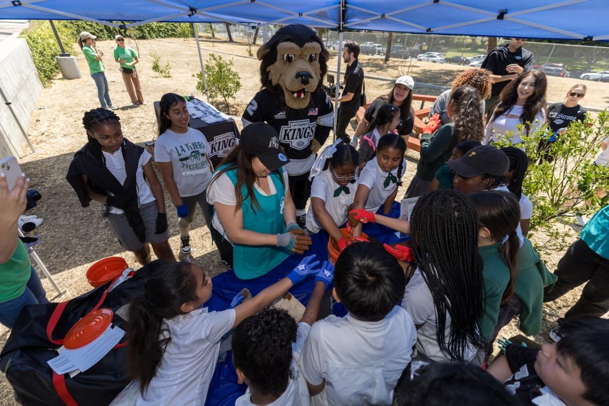 Students had fun as they joined volunteers to help revitalize their school’s gardens.