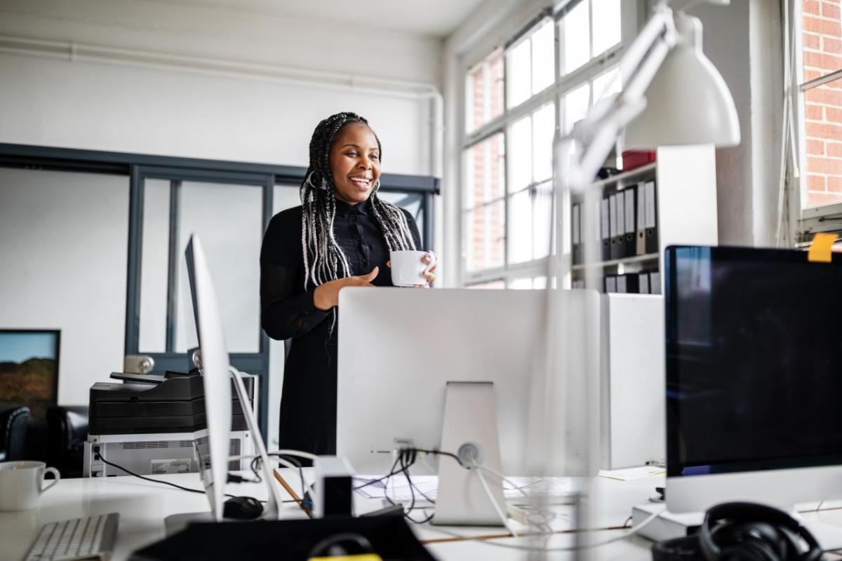 Person working at desk with computer