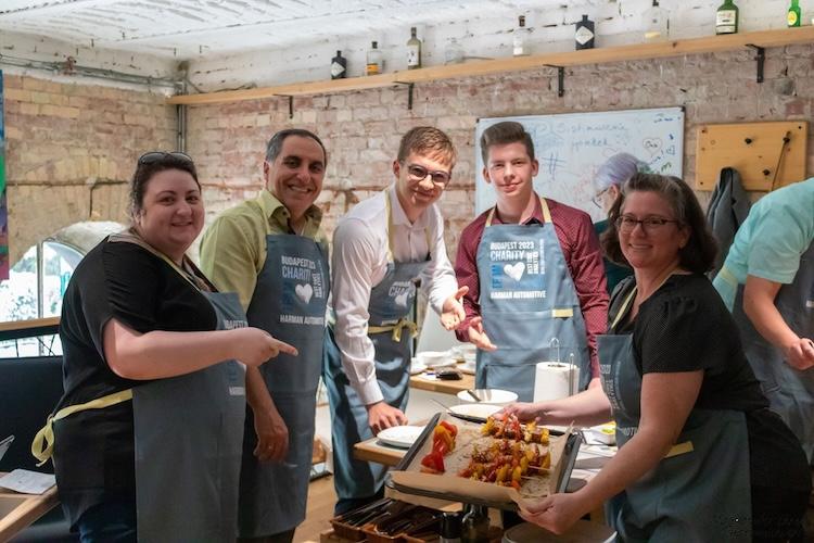 HARMAN volunteers shown preparing meals for the homeless.