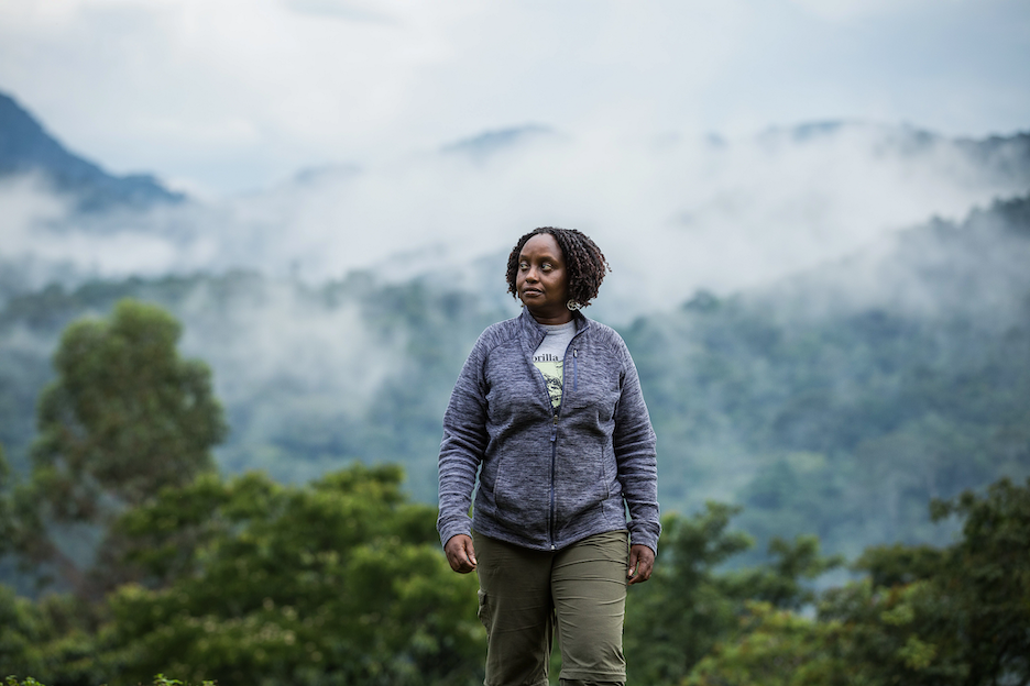 Dr. Gladys Kalema-Zikusoka - 2021 Champion of the Earth for Science and Innovation. Photo credit: UN Environment Programme (UNEP) person hiking in the mountains