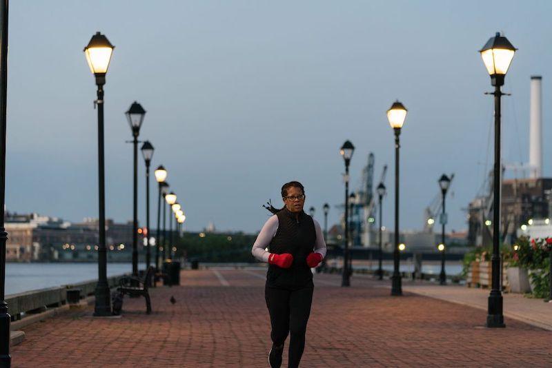 Photo: Susan Clayton, founder of apparel company WhitePaws RunMitts, in a scene from GoDaddy's "Made in America." Susan Clayton, founder of apparel company WhitePaws RunMitts, in a scene from GoDaddy's "Made in America."