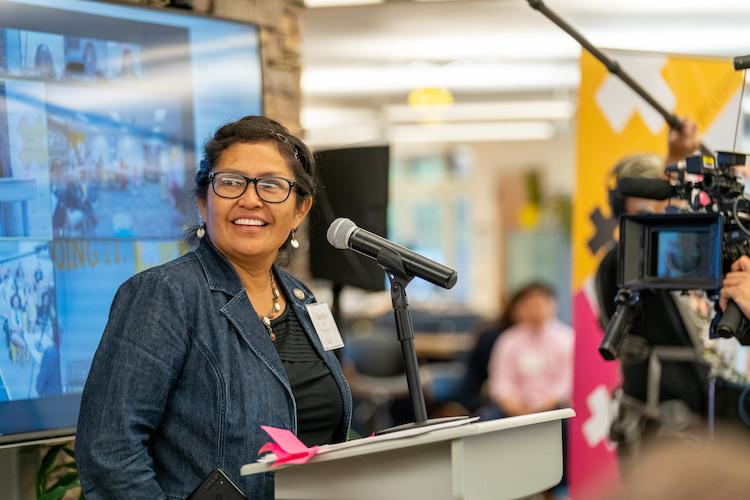 Cherilyn Yazzie standing at a podium