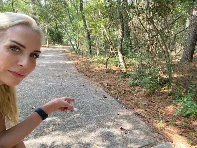 Mel Saettone hiking on a path.