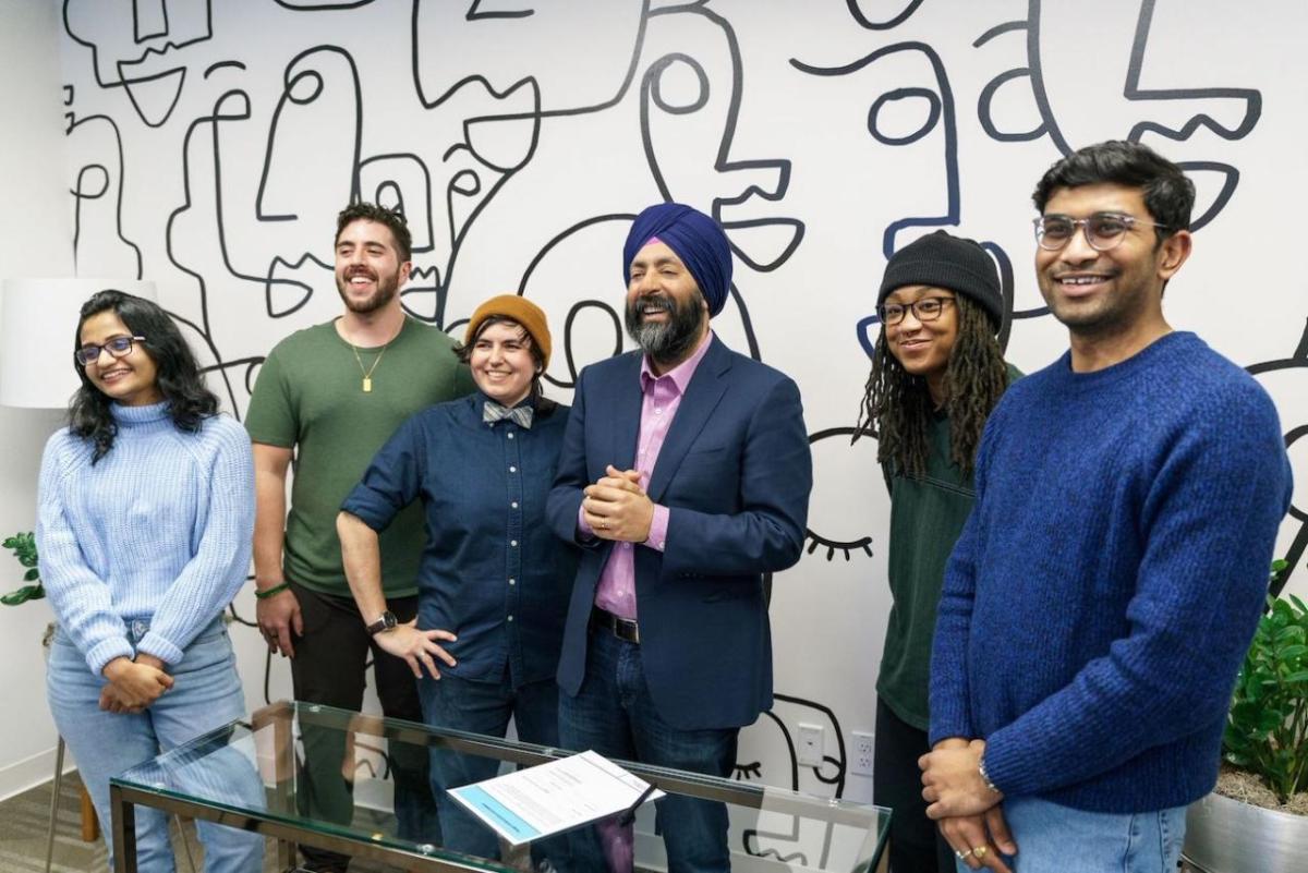 Photo: GoDaddy CEO Aman Bhutani & employee resource group members " "