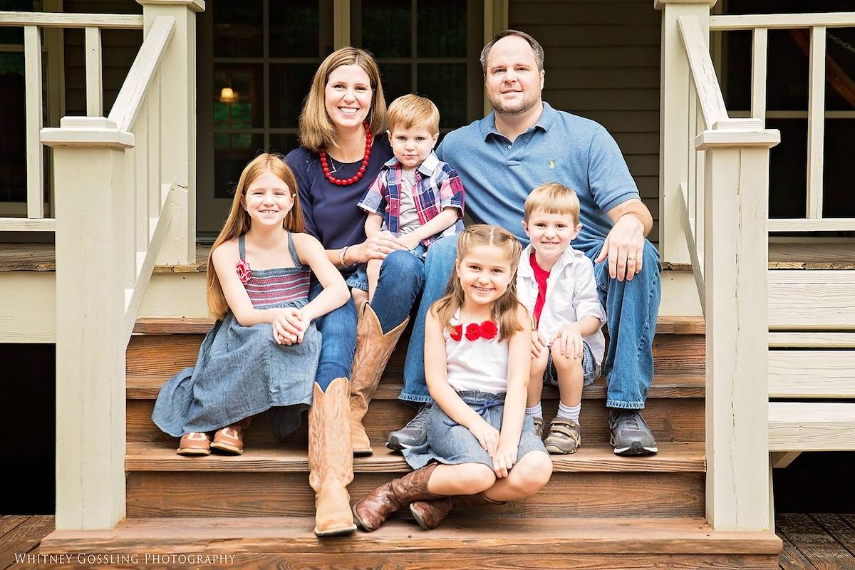 The Gossling family shown on the front porch of their home.