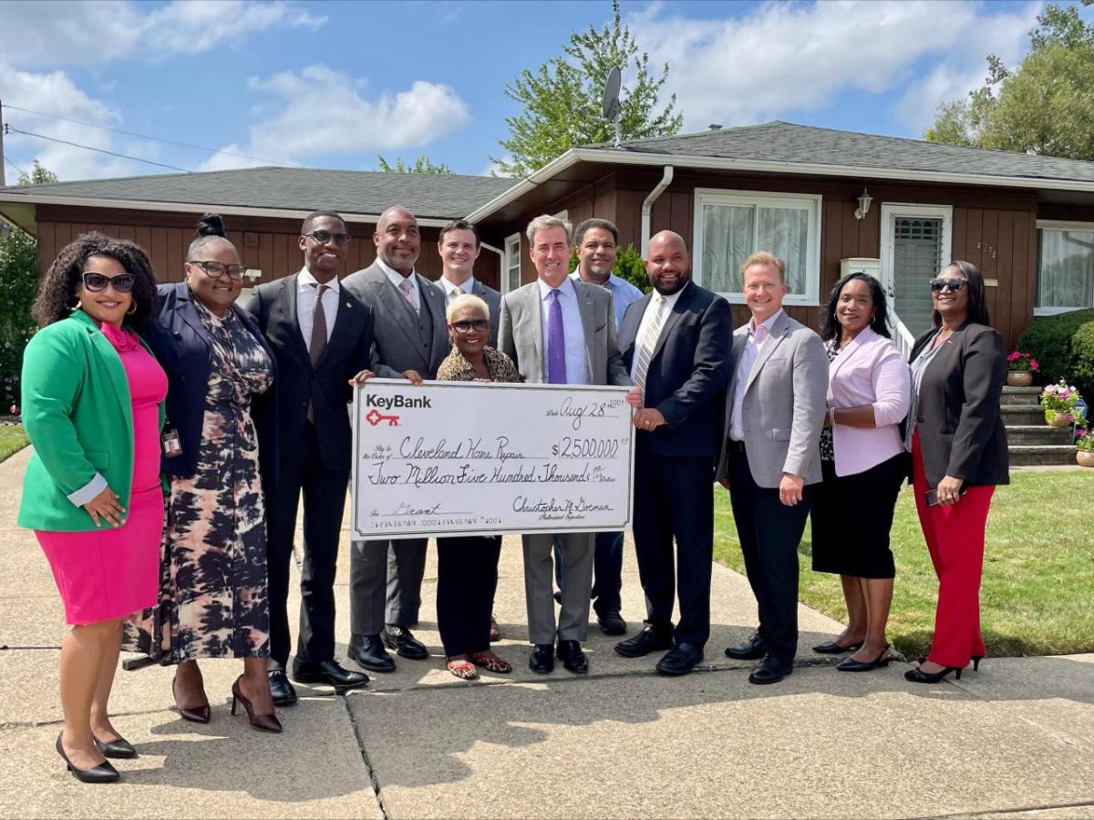 Officials from the City of Cleveland, KeyBank and community partner organizations celebrate $2.5 million grant from KeyBank Foundation for new home repair programs. Officials standing together