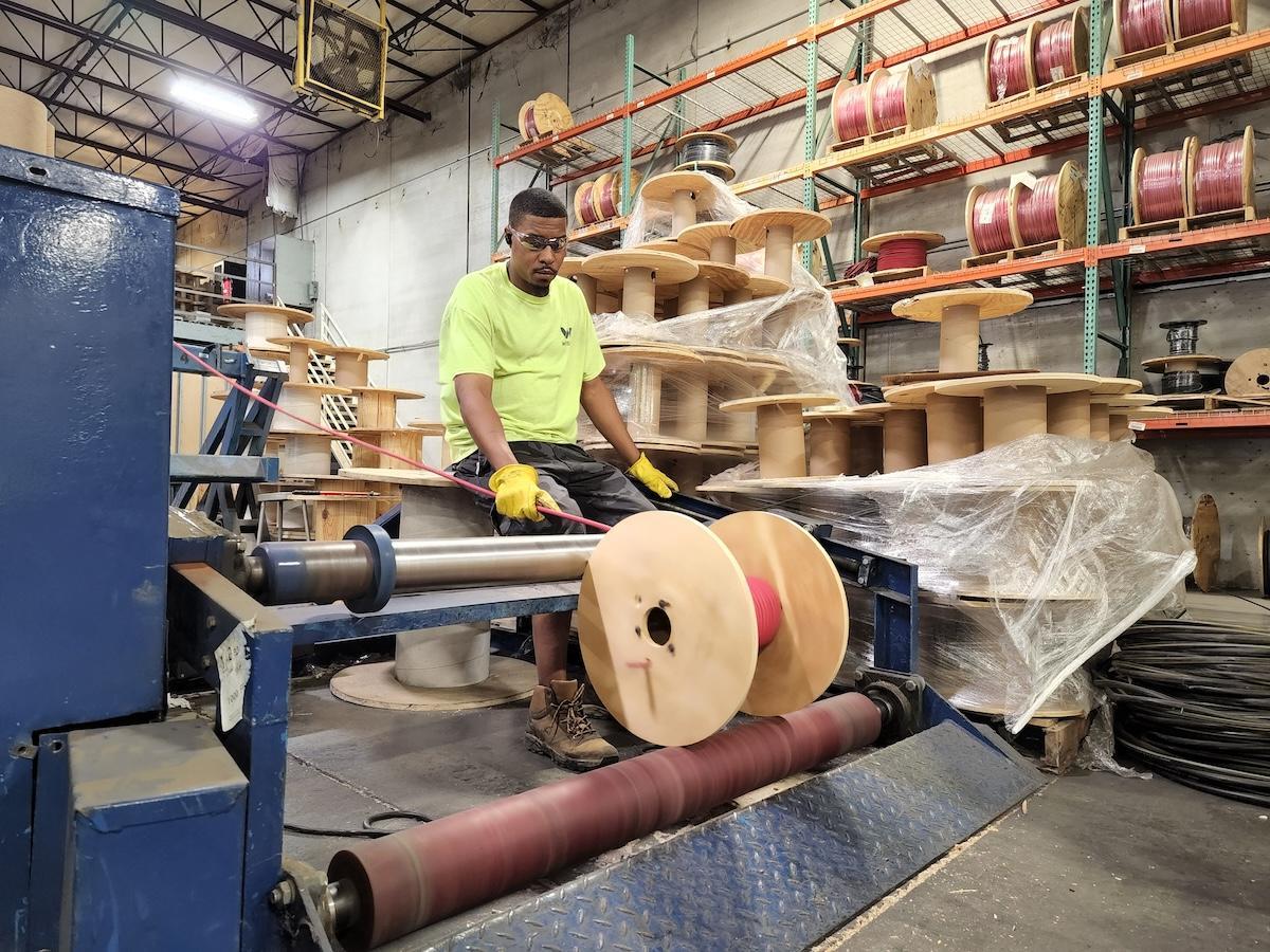Wesco employee cutting wire in Kansas City, Kansas.