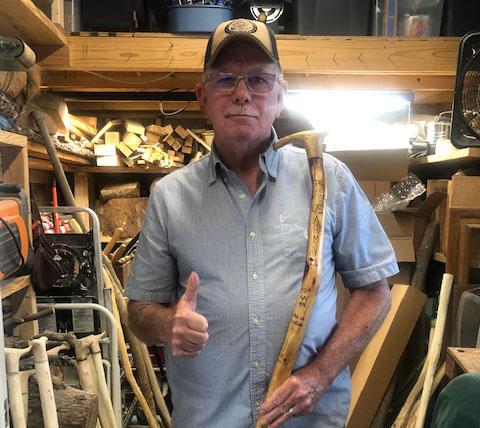 Guy of Guy's Canes for Veterans posing with a cane.