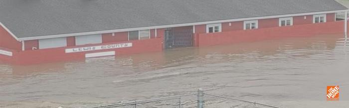 Lewis County Gospel Mission flooded in a historic January flood. Flood waters are up to window height.