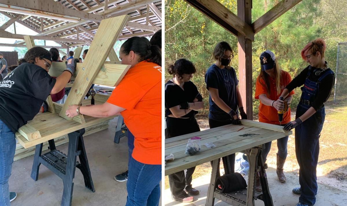 Home Depot volunteers work with Girl Scouts to build a picnic table.