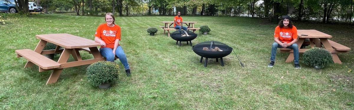 Home Depot Team members seated at picnic tables.