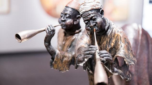 Solid bronze figures of pipers