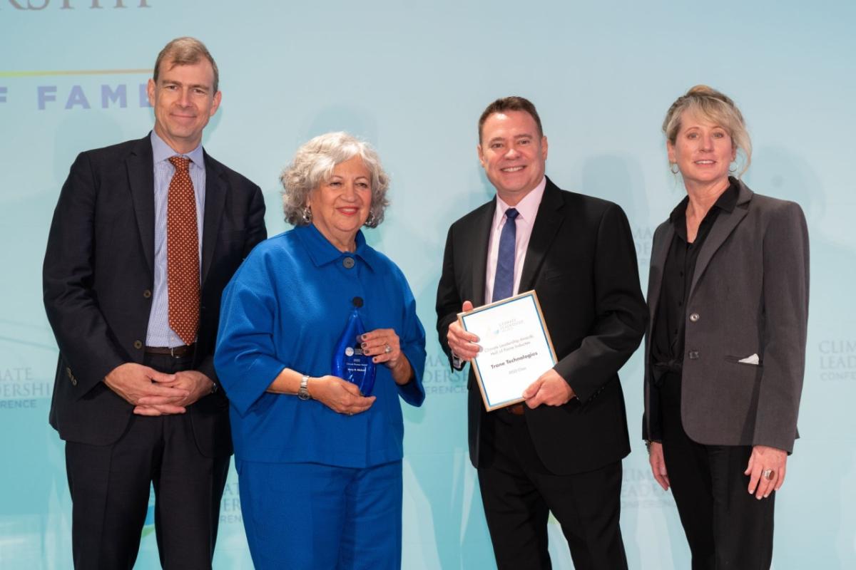 Scott Tew (second from right), Vice President, Sustainability and Managing Director of the Center for Energy Efficiency & Sustainability at Trane Technologies (CEES) accepts Trane Technologies’ induction into the Climate Leadership Awards Hall of Fame. He is joined on stage by Nathaniel Keohane (left) President of C2ES, Mary Nichols (second from left), 2022 Climate Pioneer Award winner, and Amy Holm (right), Executive Director of the Climate Registry. Scott Tew (second from right), Vice President, Sustainability and Managing Director of the Center for Energy Efficiency & Sustainability at Trane Technologies (CEES) accepts Trane Technologies’ induction into the Climate Leadership Awards Hall of Fame. He is joined on stage by Nathaniel Keohane (left) President of C2ES, Mary Nichols (second from left), 2022 Climate Pioneer Award winner, and Amy Holm (right), Executive Director of the Climate Registry.