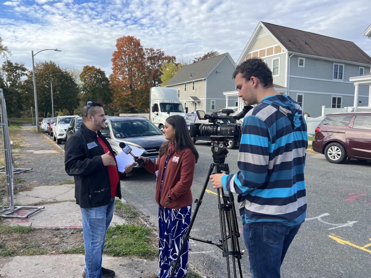 Members of the press at Habitat for Humanity event in Springfield, MA.