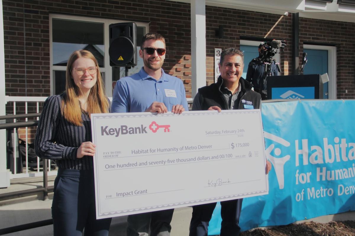 Team members from Habitat for Humanity shown with a $175,000 grant check from KeyBank.