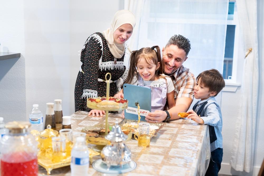 Family sitting at table together 