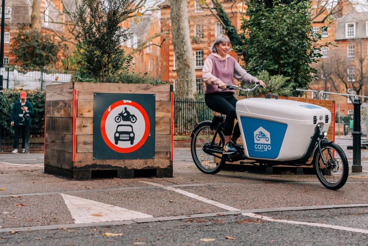 A person riding a cargo bike