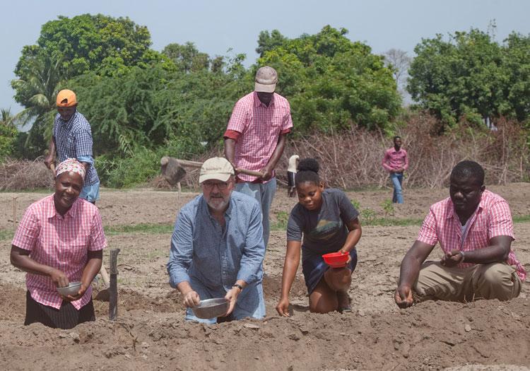 The SFA's Hugh Locke (centre left) and Timote Georges (right) take part in a cotton tutorial in Haiti courtesy Ecotextile News website