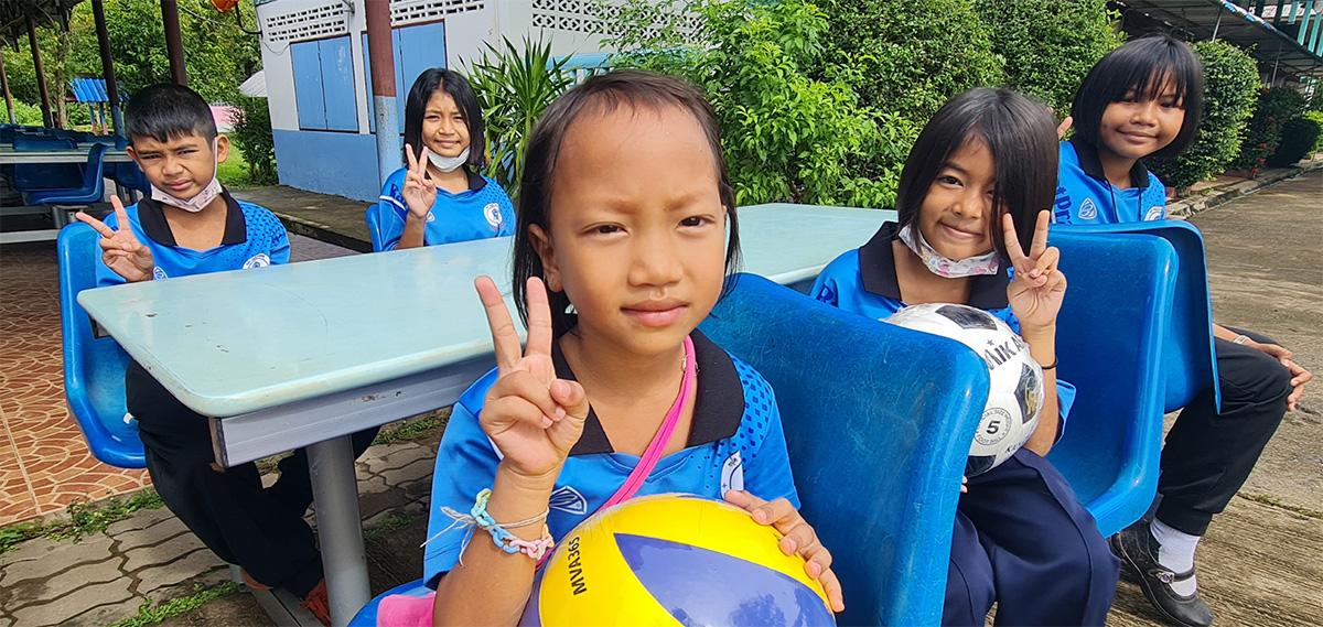 Students in Thailand seated at a table.