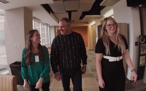 North Carolina State University students Mamie Trigg and Sydney Parker speak with Chris Fox (center), vice president of corporate social responsibility at HanesBrands. The students met with senior leadership at HanesBrands headquarters in Winston-Salem, N.C., to share insights from their step-by-step exploration of making a sustainable T-shirt.
