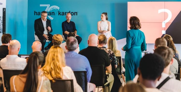 Harman Kardon team members in a meeting.