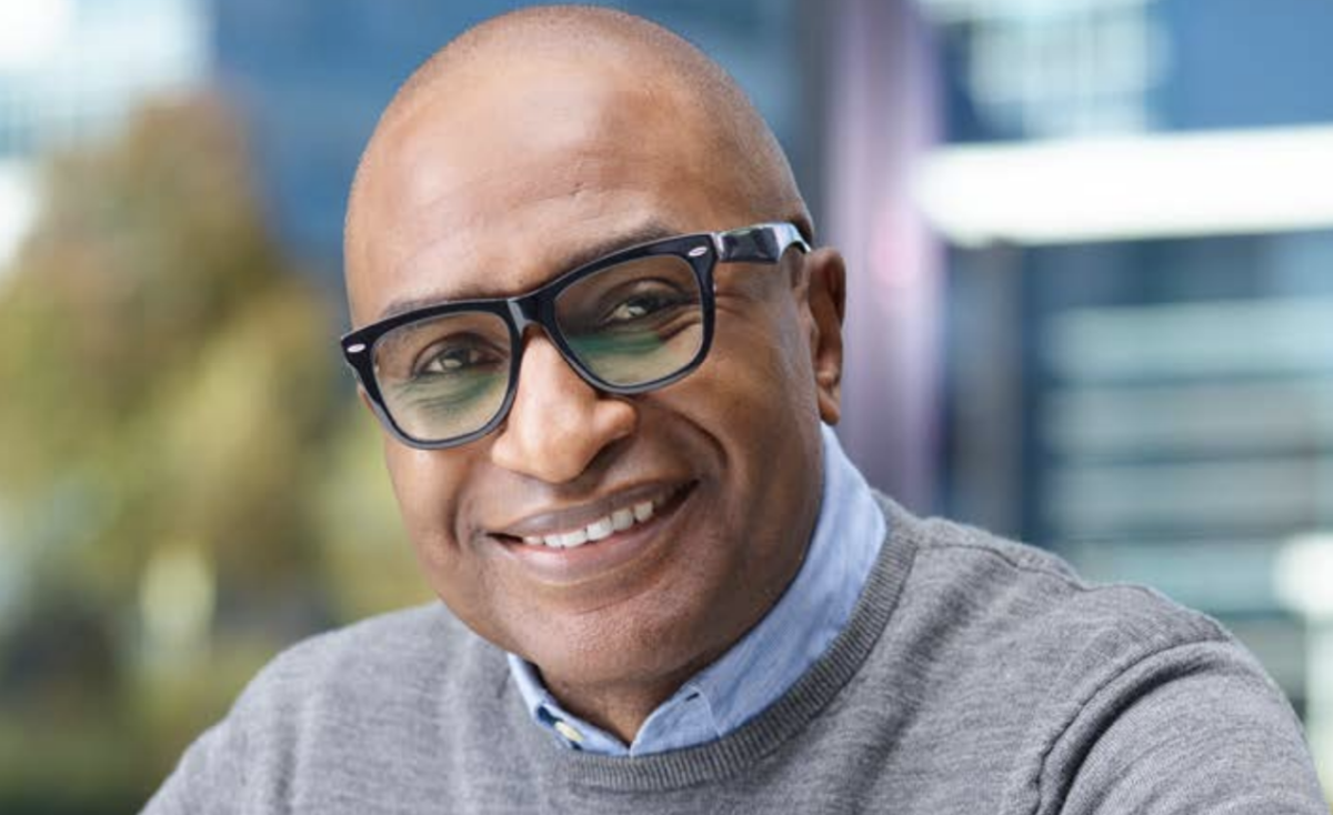 Photo of a person smiling wearing glasses