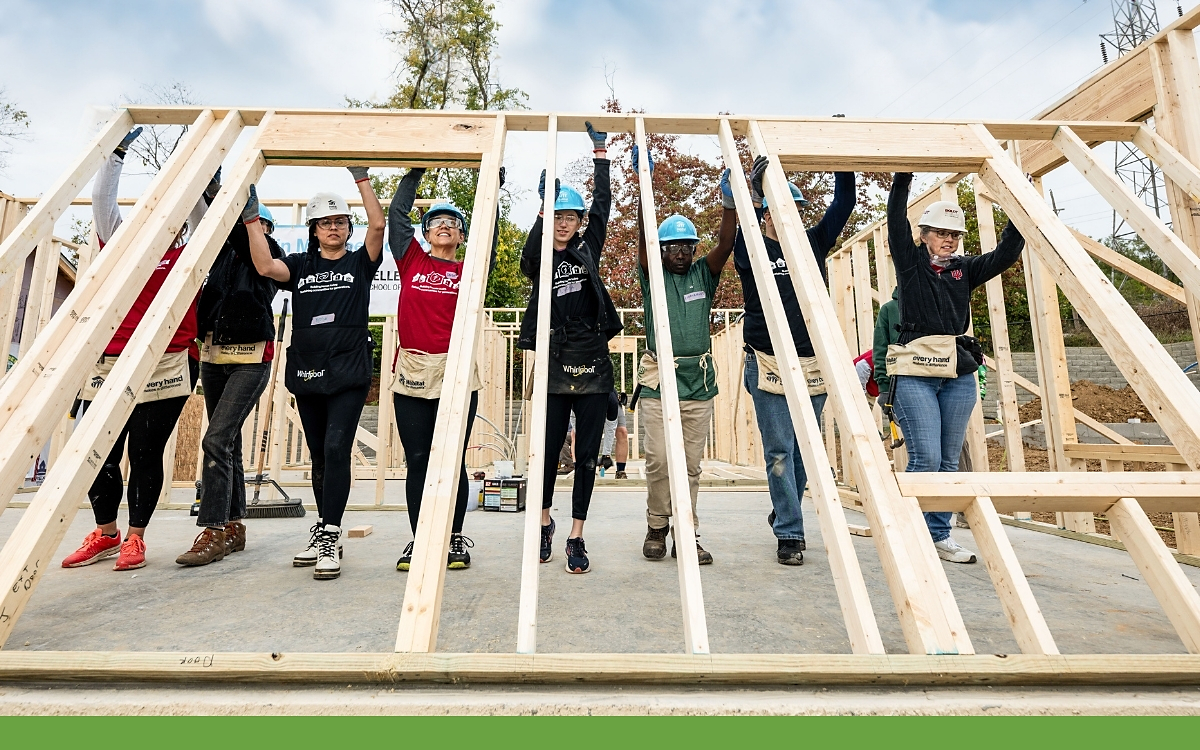 Whirlpool Corp. volunteers shown working on a Habitat for Humanity site.