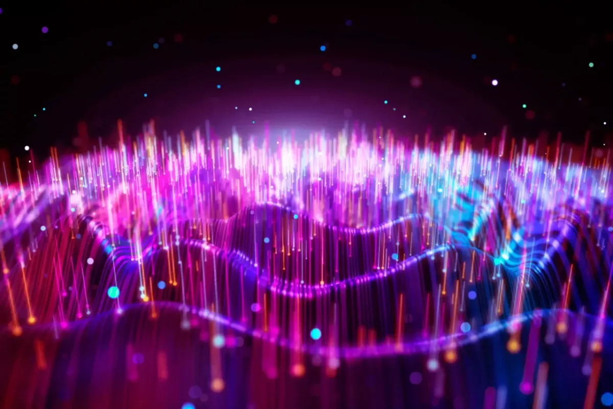 Abstract image of energy waves in red, purple, blues.