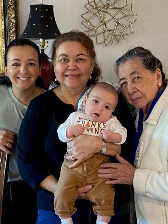 Brina R. and family holding baby